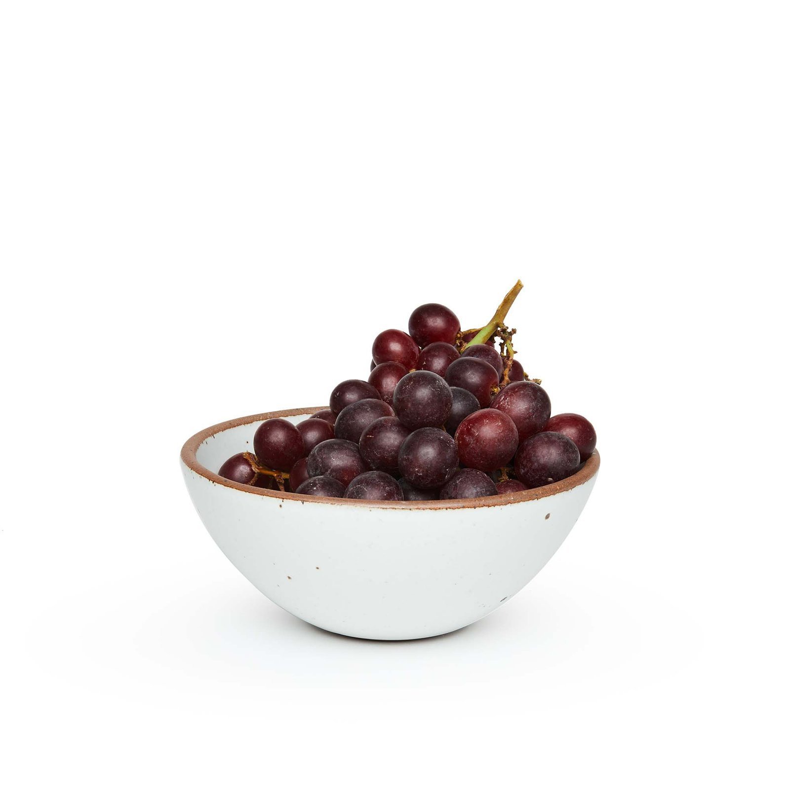 Vellax Supply soup bowl in Cloud White, shown with grapes