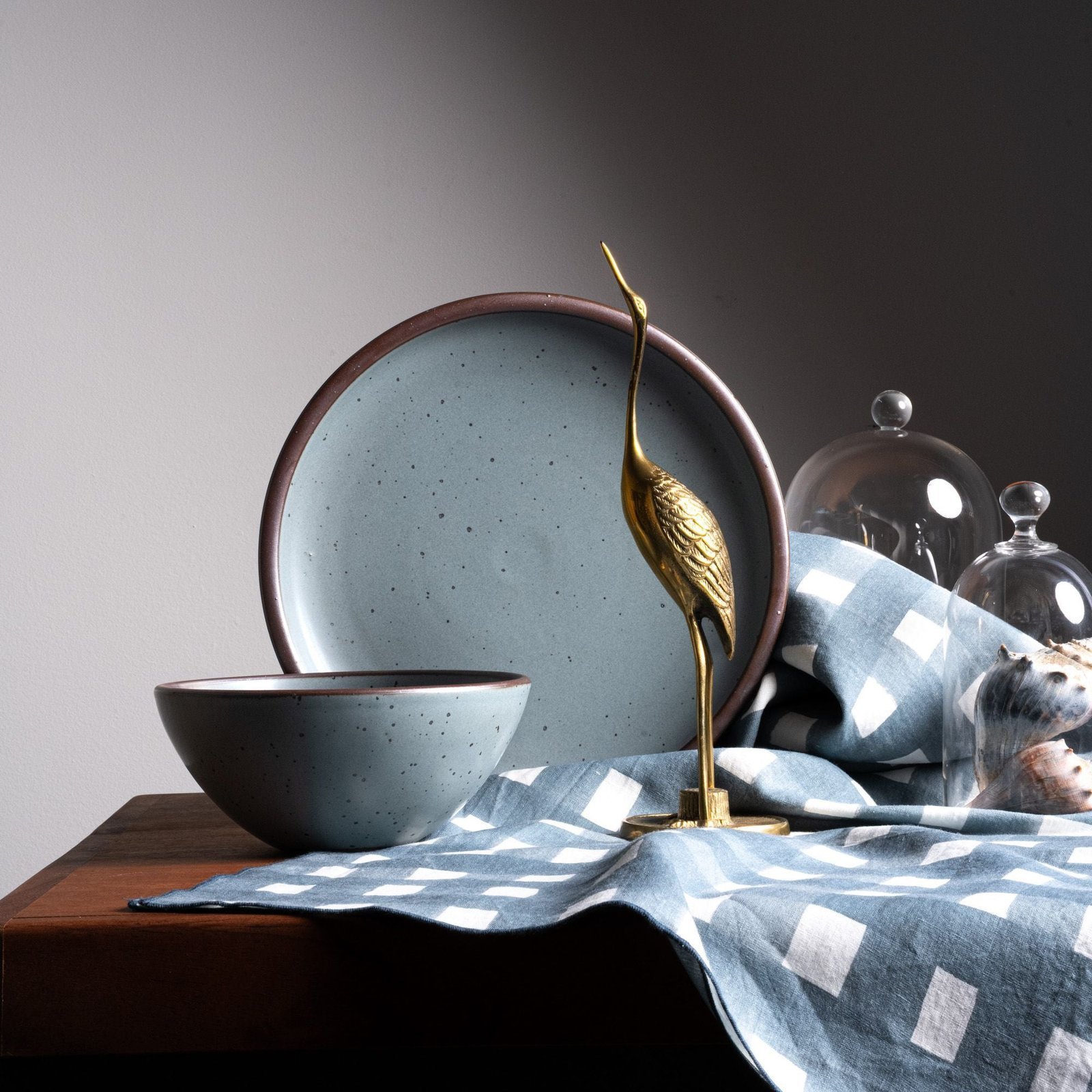 Vellax Supply soup bowl in Mist Blue, in a display with other tableware