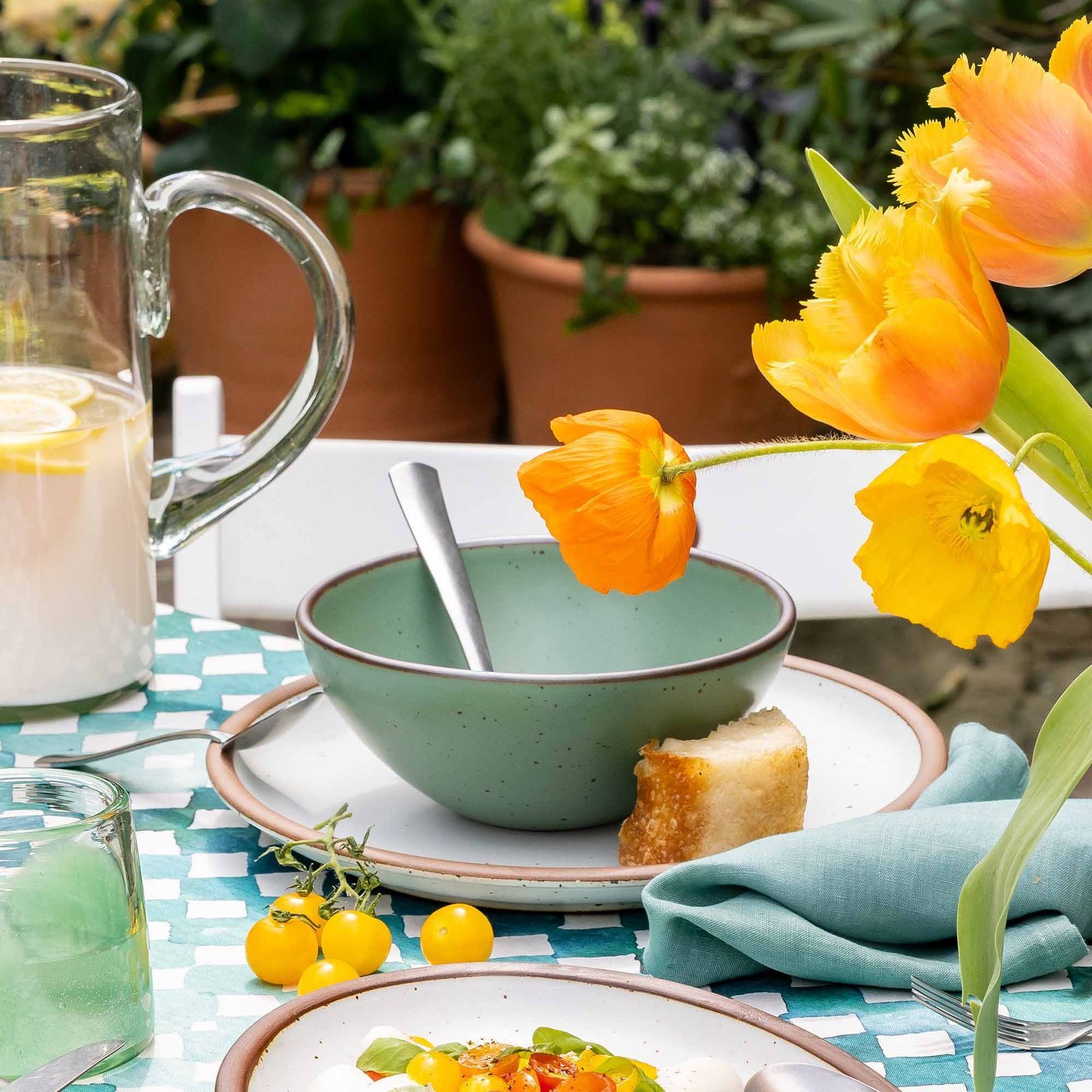 Vellax Supply soup bowl in Viridian, in an outdoor table setting